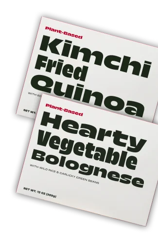 Boxes of Kimchi Fried Quinoa and Hearty Vegetable Bolognese