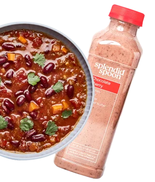 A bowl of Beans & Greens soup and a Chocolate Cherry smoothie as seen from above