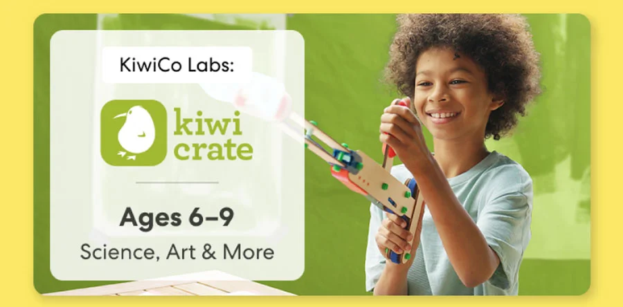 Young girl smiling while working on a science experiment from KiwiCo Labs. Hands-on STEM learning for ages 6–8.