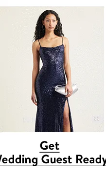 A woman wearing blue sequined maxi dress.