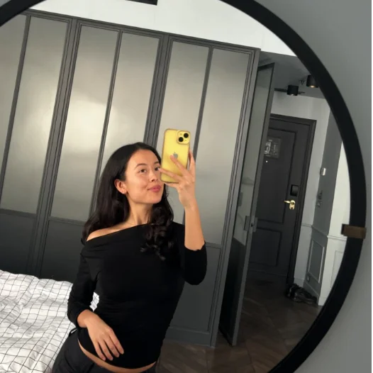 Woman taking mirror selfie