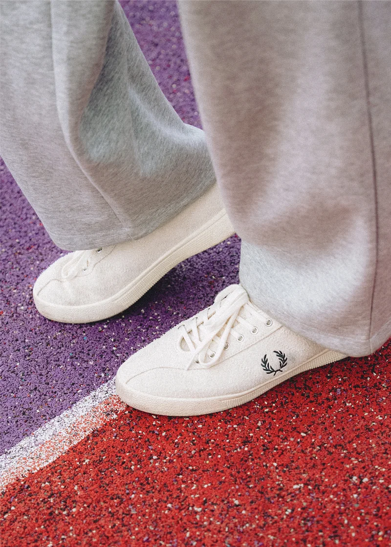 Close up of a Fred Perry Tennis Shoe on a Tennis Court