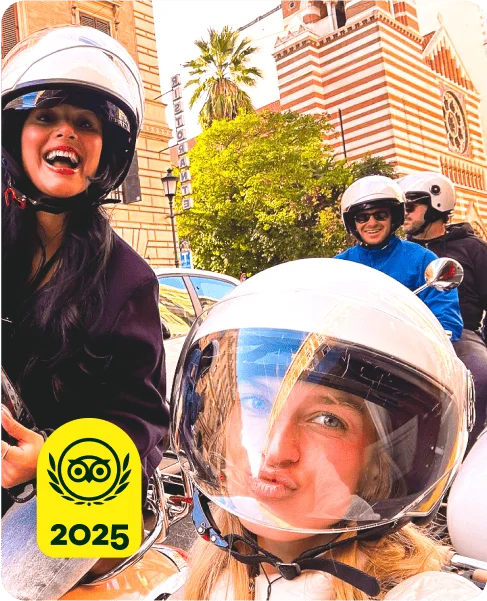 Image Description: Two people smiling on a Vespa. A yellow 2025 Travelers’ Choice Awards Best of the Best badge is on the bottom left corner of the image.