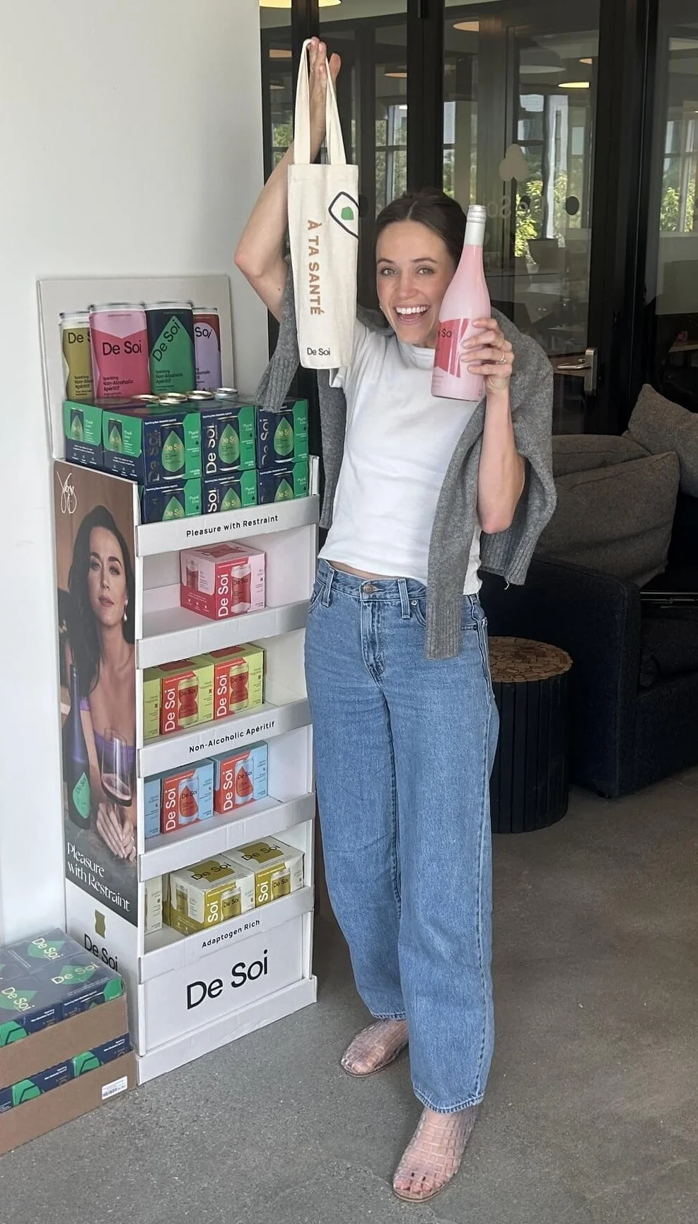 Me holding a Très Rosé bottle and the free wine tote!