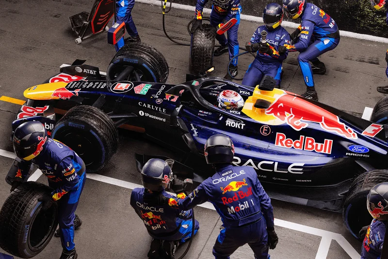 Oracle Red Bull Racing vehicle being serviced by a pit crew.
