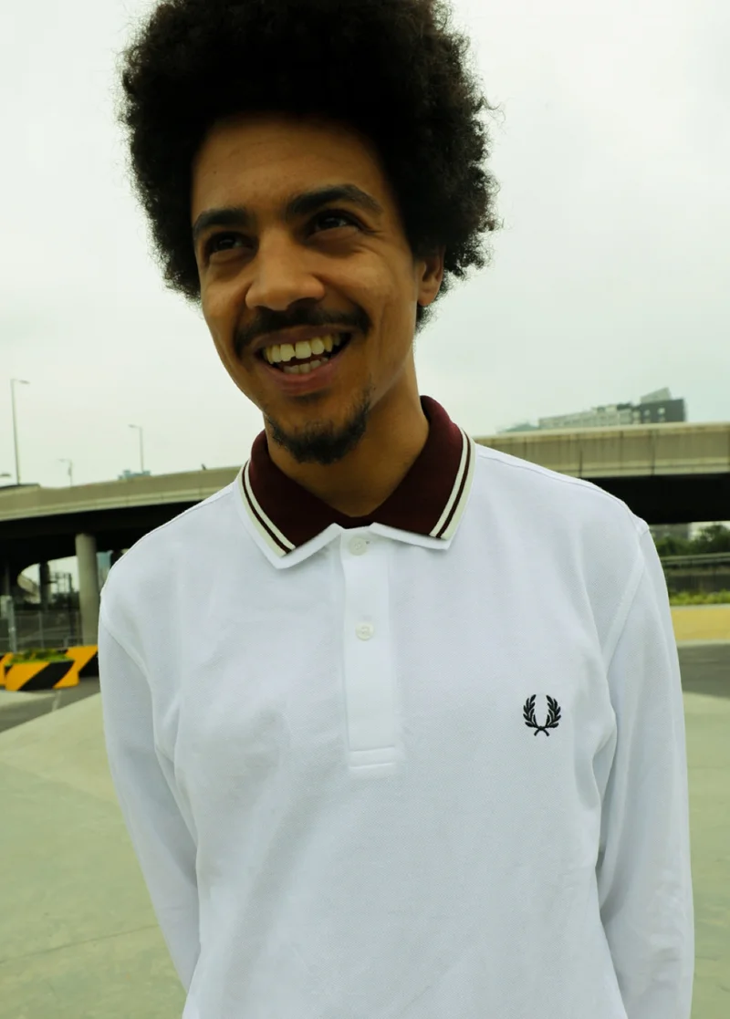 Fred Perry Ambassador wearing a long sleeved Fred Perry Shirt