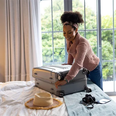 A woman packing for a trip