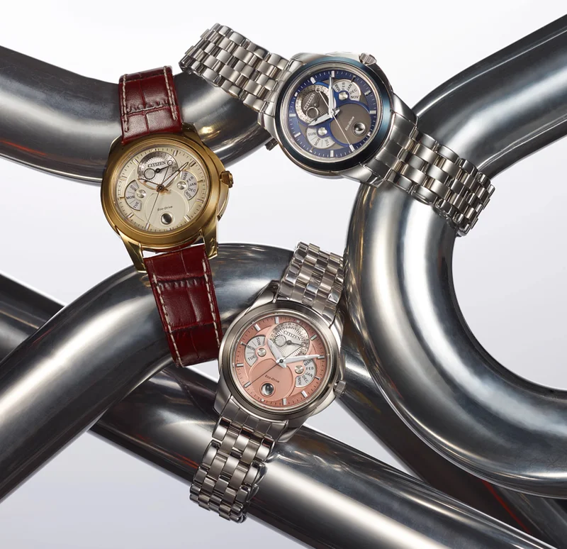 Images of three new men's Calendrier watches on metal rods
