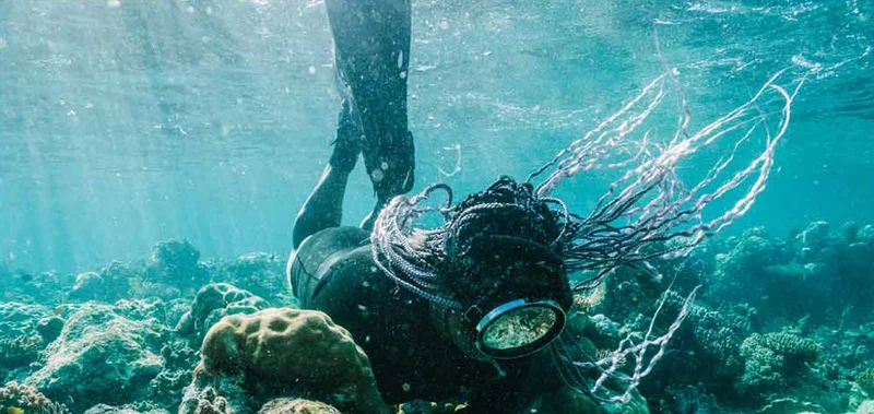 Diver in coral reef