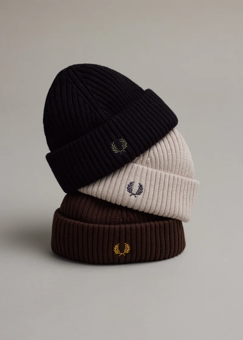 Stocking Fillers - image shows 3 ribbed beanies stacked on top of each other in colours black, beige and brown