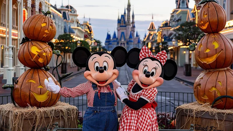 Image description: Minnie and Mickey Mouse at Disney World for Halloween.