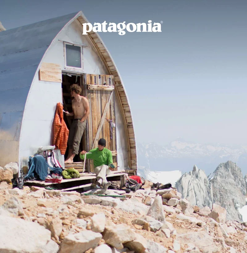 Patagonia. Two people on the porch of a high alpine hut.
