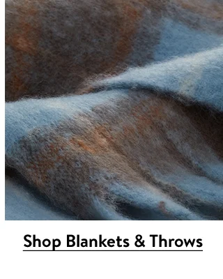 A plaid throw blanket.