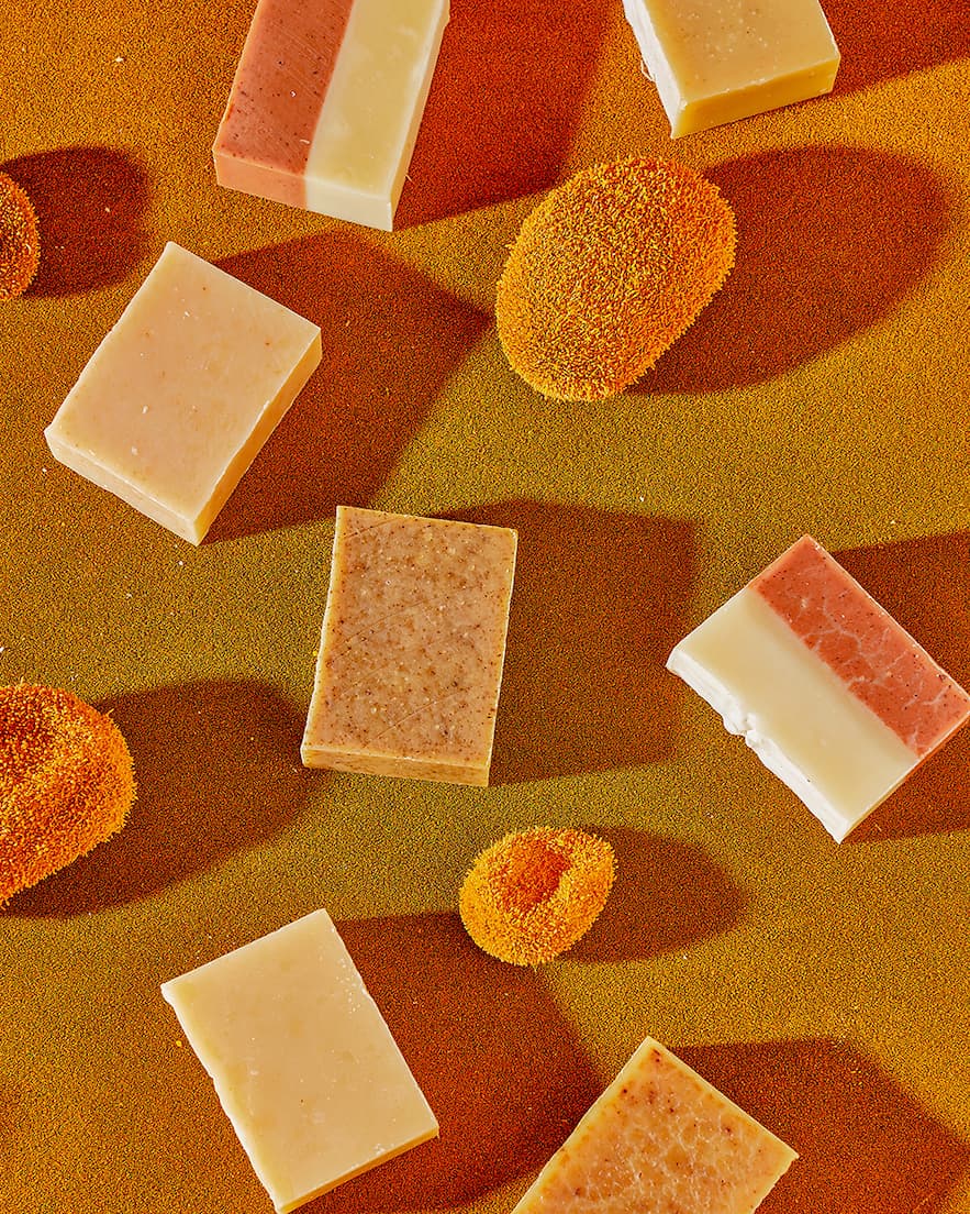 Bar soaps on a desert-like background