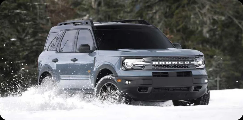 A Ford Bronco Sport driving in the snow.