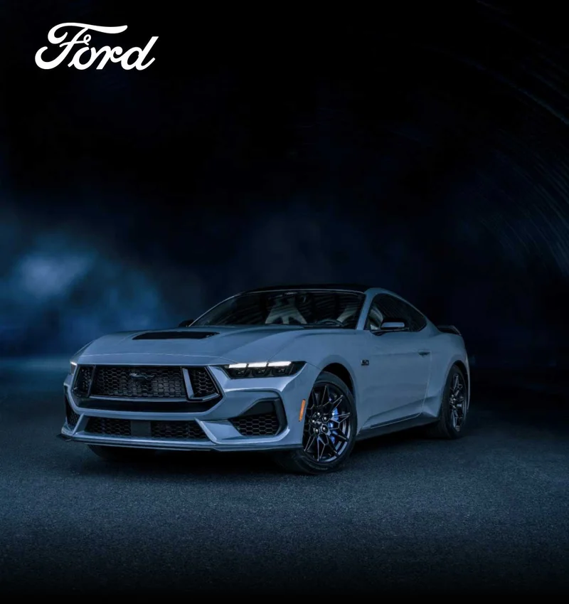 A Ford Mustang parked at night.