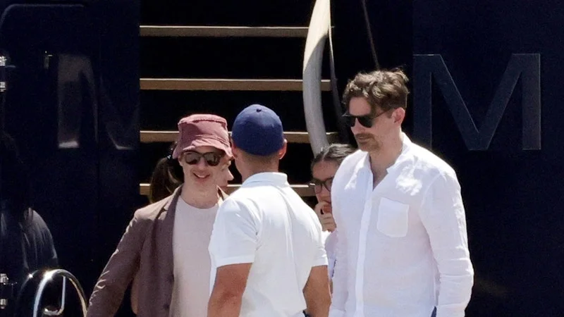 EXCLUSIVE Capri, ITALY Bradley Cooper and Jeremy Strong were spotted disembarking a yacht in Capri with friends. Strong stood out in a bucket hat, echoing his Cannes Film Festival style.