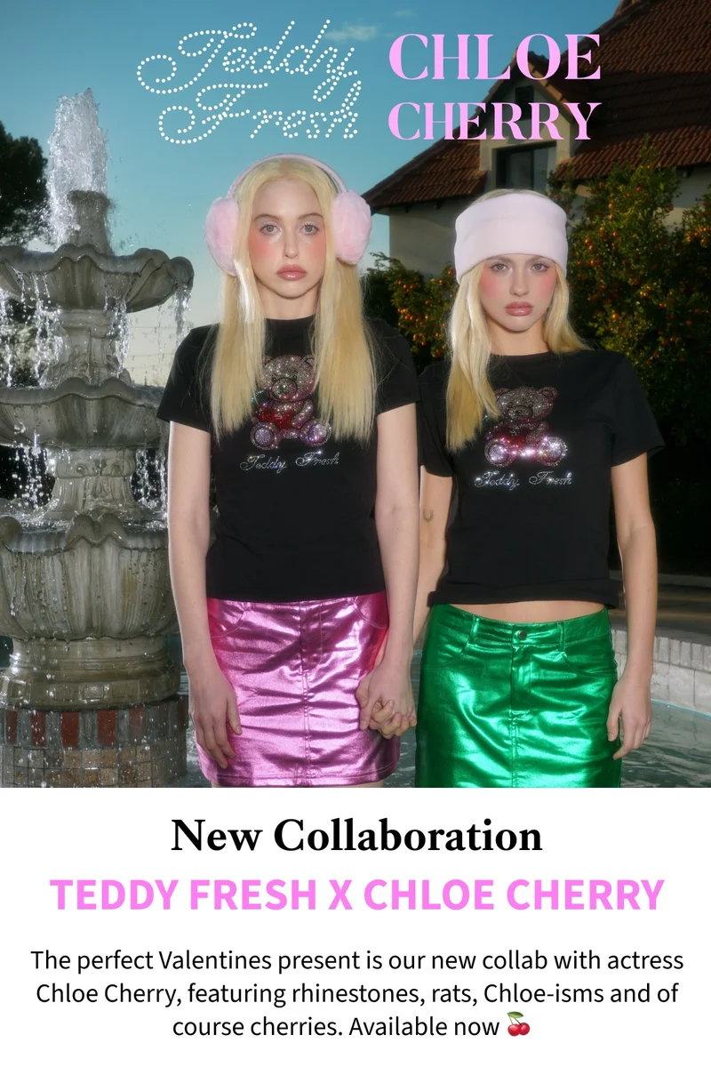 two models standing in front of a fountain in our new rhinestone t-shirts