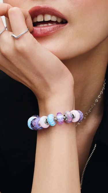 Fully loaded Murano charm bracelet on wrist