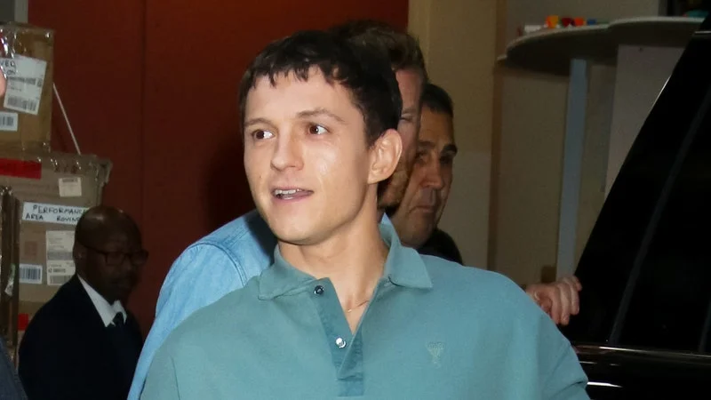 Tom Holland wearing a long-sleeve pique polo from Ami Paris.