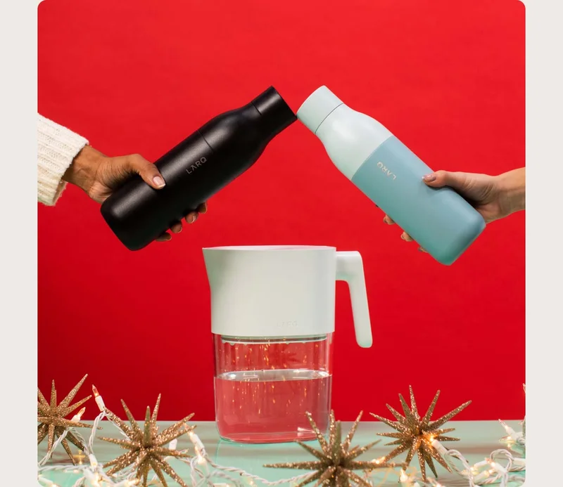 two LARQ Bottle PureVis cheersing over a LARQ Pitcher PureVis