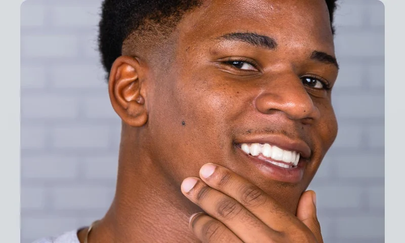 Man touching his freshly shaven face