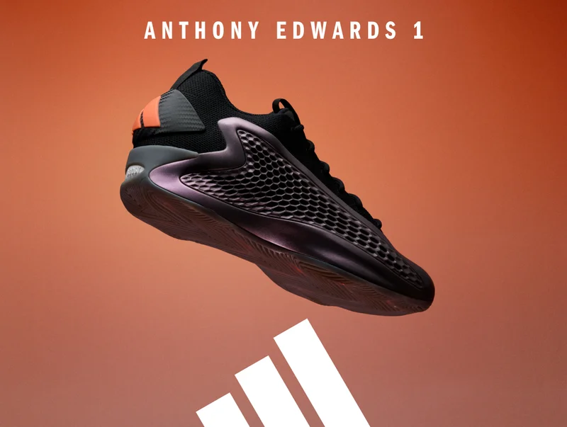 AE1 Low Iron Metallic sneaker in front of an orange background