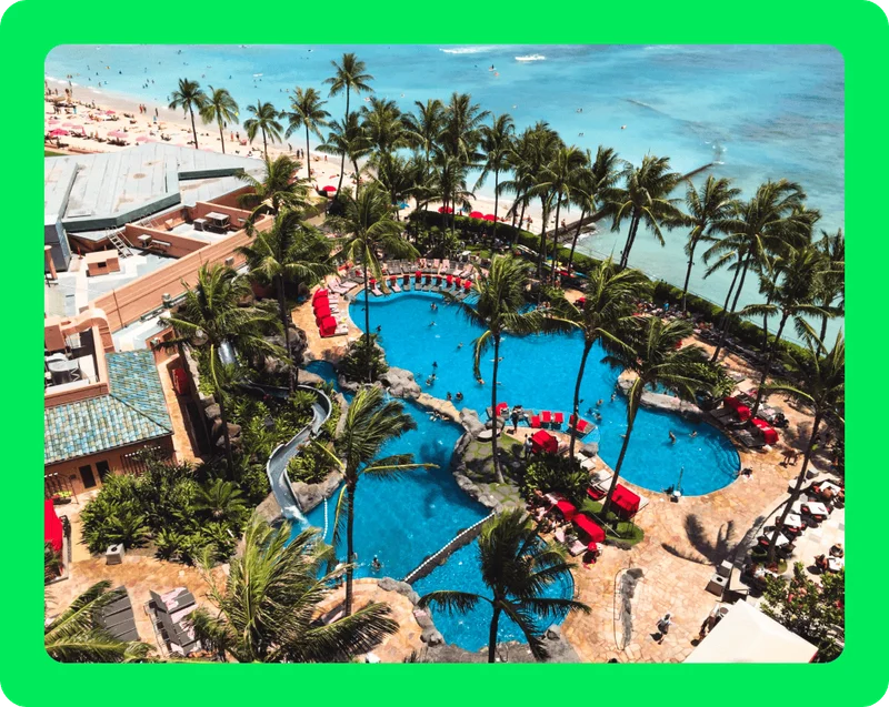Image Description: A beach resort with two large pools overlooking the ocean.