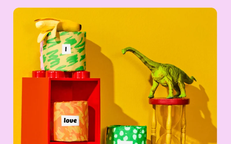 Image: Who Gives A Crap Poetry Edition TP in Lego shelves next to a dinosaur