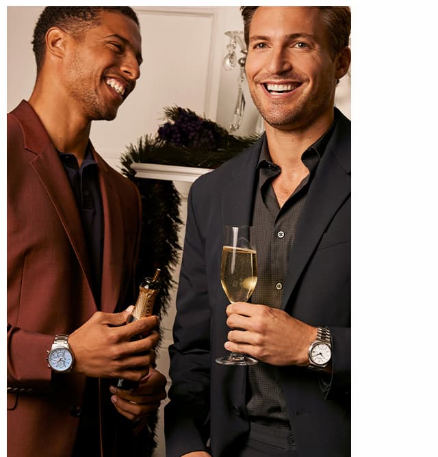 Two men with champagne and wearing AT8260-51M and AW0130-85A