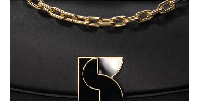 Classic colors and statement details (we love that clasp) mean it will go with everything - and everyone will want one.