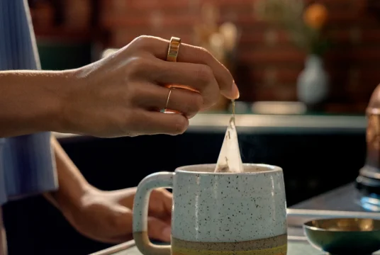 Hand making tea wearing Oura Ring