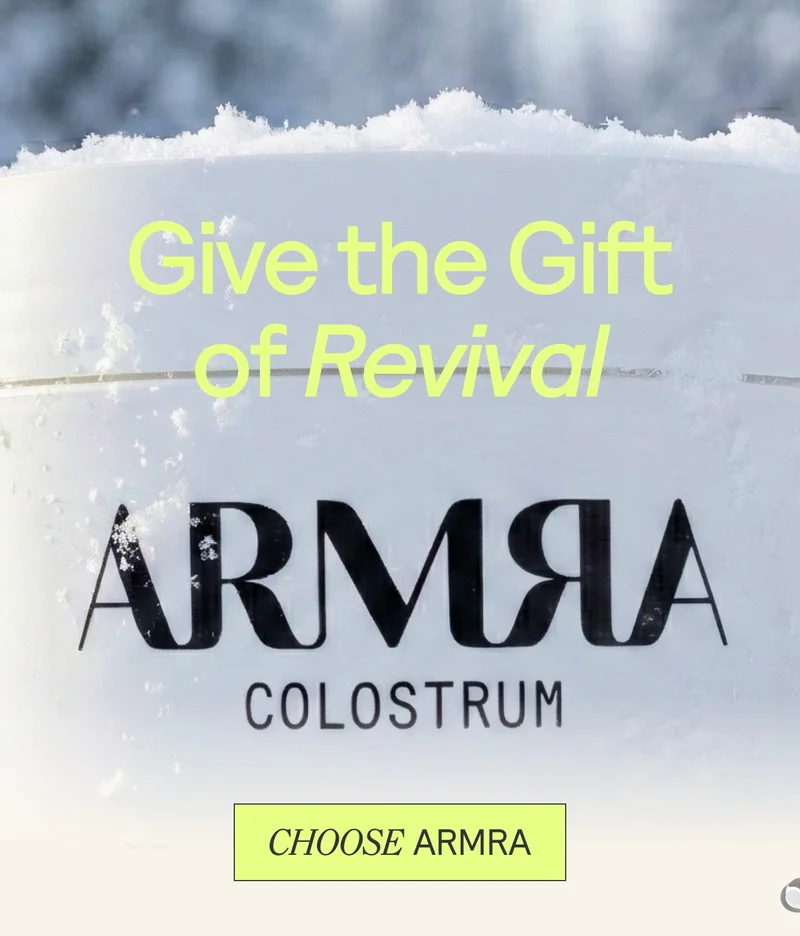 ARMRA Colostrum container with the headline “Give the Gift of Revival” displayed over a frosted, winter-inspired background.