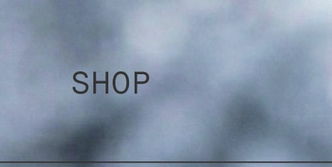 Navigation link labeled “Shop” on a soft, misty blue background.