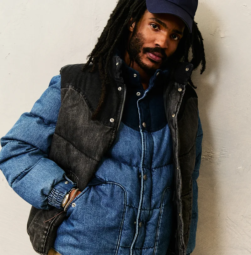 PERSON IN PUFFER VEST AND JACKET