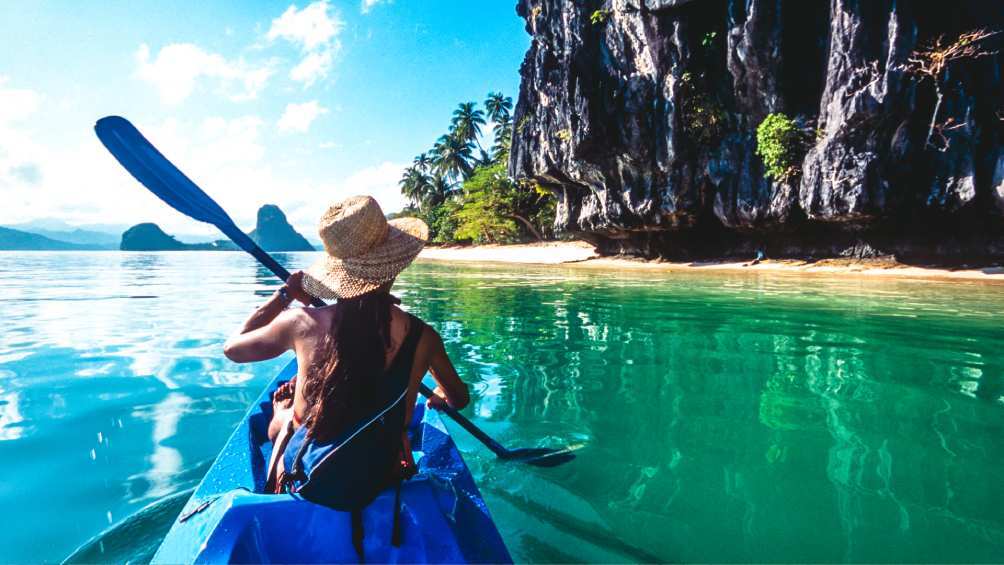 Image description: Sea kayaking in Bacuit Bay, El Nido, The Philippines.