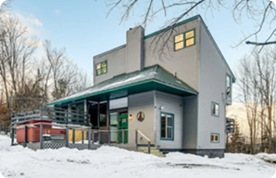Savor the charm of a snow-covered private home rental in Stowe, Vermont.