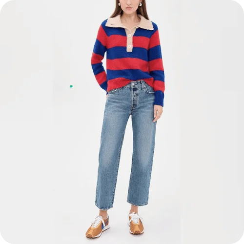 a model wearing levi's 501 '90s ankle jeans with a striped sweater and sneakers a model wearing levi's 501 '90s ankle jeans with a striped sweater and sneakers