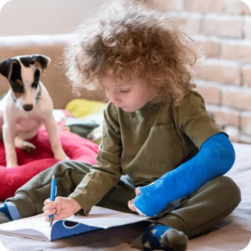 a little kid with a broken arm in a blue cast a little kid with a broken arm in a blue cast