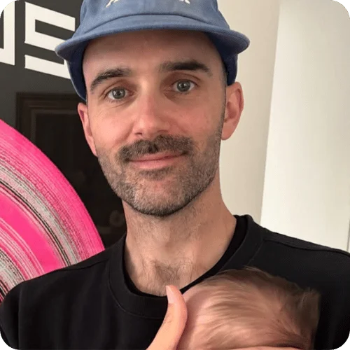 the creator @nonpracticinggenius smiling while holding his baby the creator @nonpracticinggenius smiling while holding his baby