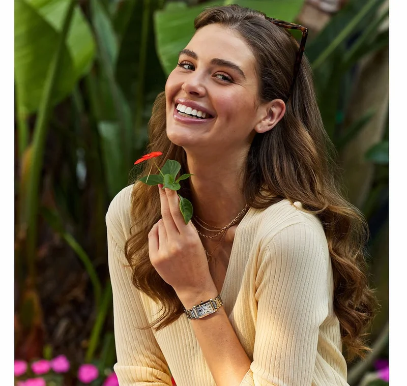 A woman with a flower wearing the Citizen L Bianca