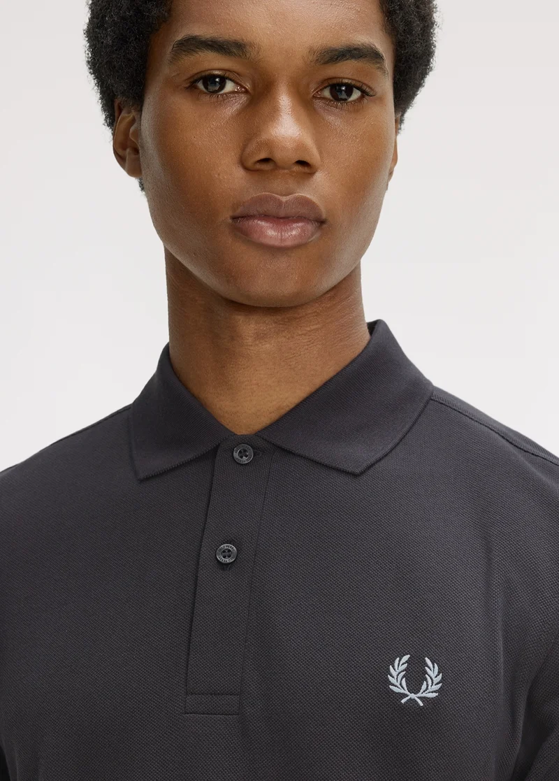 New Releases Men: male model wears Fred Perry Shirt in Anchor Grey