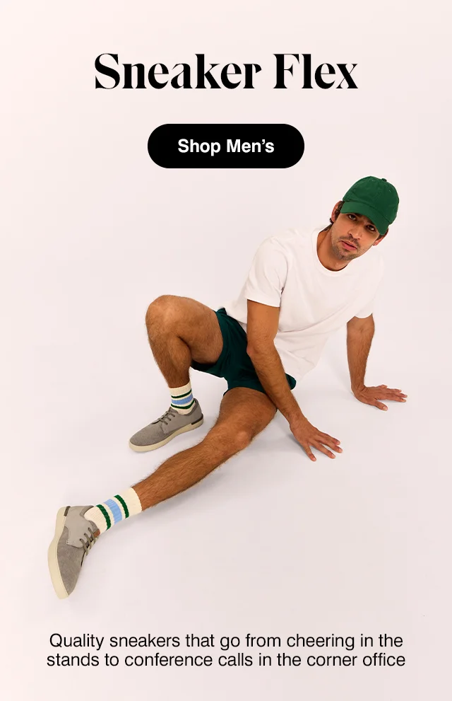 Man in green baseball cap, white tee, emerald shorts, striped socks and the Bear sneaker in Light Grey. Shop Men's.