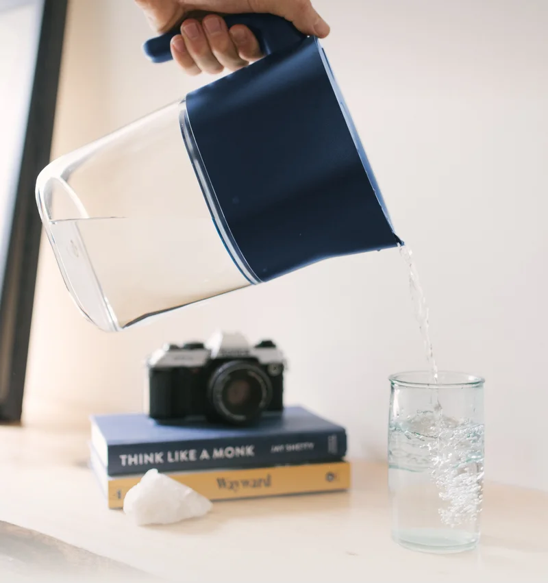 LARQ Pitcher PureVis pouring water into a glass