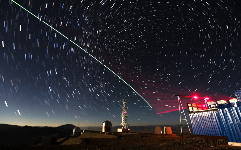 This composite photo shows a satellite-to-earth link established between quantum satellite 'Micius' and a quantum teleportation experiment platform in Tibet.