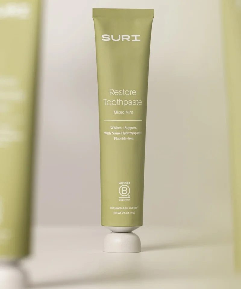 SURI Restore Toothpaste imagery showcasing the product shot in the center - in flavour 'mixed mint'
