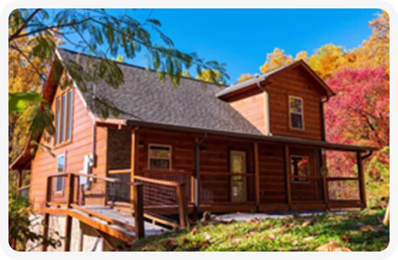 Escape to a rustic private cabin surrounded by vibrant fall foliage in Gatlinburg, Tennessee.