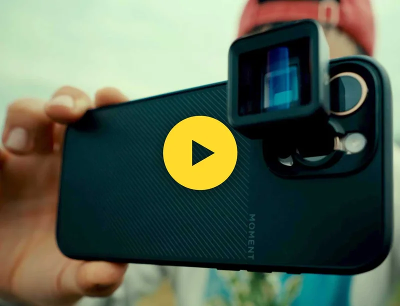 Thumbnail of a youtube video with an image of a phone equiped with a moment lens