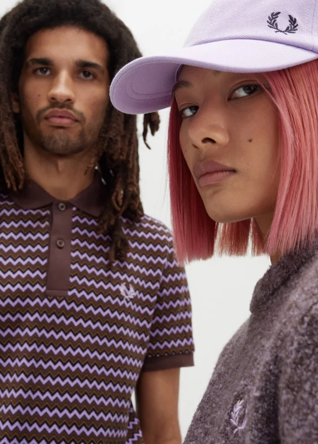 Man and Woman wearing varies ultraviolet clothing items and accessories