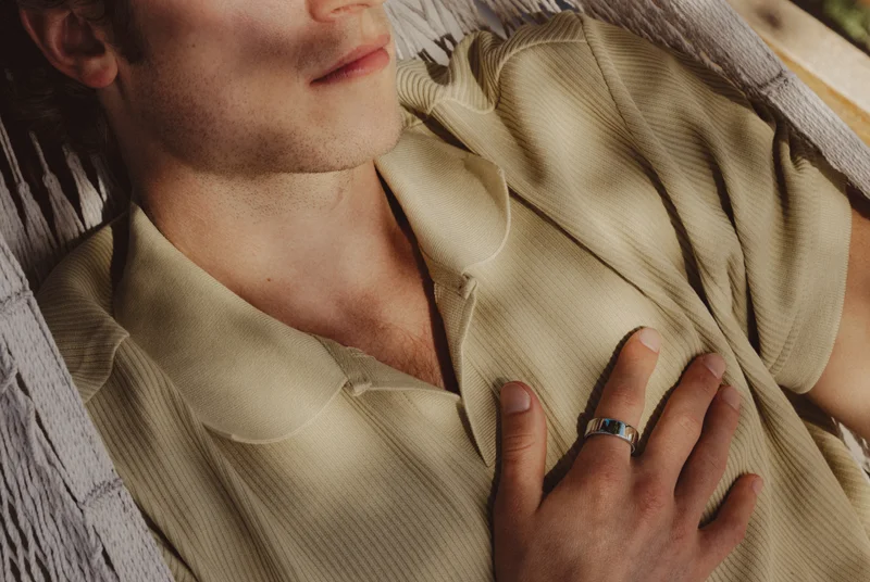 Person wearing Oura Ring lying in a hammock
